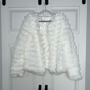 White fluffy jacket.
